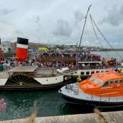 The Waverley arrives in Milford Haven accompanied by the Angle lifeboat