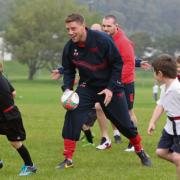 REDS ON THE ROAD: Rhys Priestland gets stuck in at Burry Port RFC as part of Scarlets' Community Roadshow. Pic: Riley Sports Photography