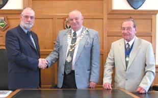 New deputy mayor-elect Councillor David Friend (left) is congratulated by Milford Haven mayor Councillor Tony Eden and mayor-elect Councillor Eric Harries.
