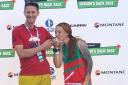 Sanna Duthie recieves her trophy for completing  the Montane Dragon’s Back Race.