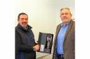 Owen James presents VC Gallery founder Barry John with one of the limited edition bottles