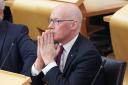 John Swinney, pictured in the Scottish Parliament yesterday, is considering standing for the positions of SNP leader and First Minister
