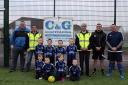 The Hakin Under 7s with coaches Tristan Carlson and Jamie Roberts, representatives of C&G Scaffolding, and club secretary Jonathan Lewis.