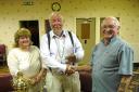 CHEQUE IT OUT:  Linda Hawkins-Davies, Ron Southwell (being presented with the proceeds) and Emrys Stephens.