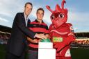 IN TUNE: Scarlets centre Jonathan Davies launched digital radio for West and Mid Wales at Parc y Scarlets on Friday evening. Pictured with Laurence Harrison from Digital Radio UK and Cochyn.