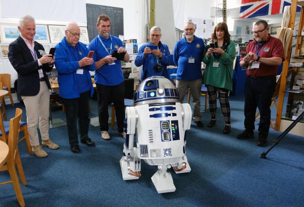 Milford Mercury: R2-D2 enjoying the company of the centre's volunteers. Picture: Martin Cavaney Photography