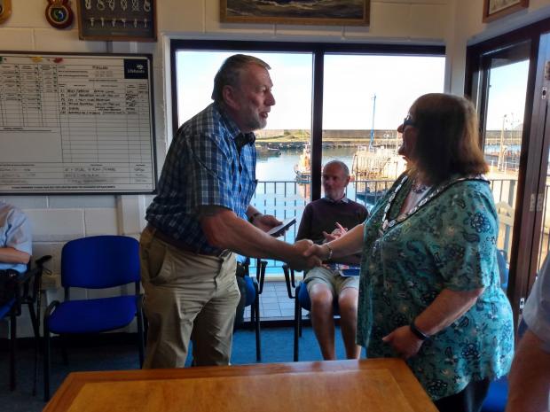Milford Mercury: Deputy launching authority Chris Williams receives his medal