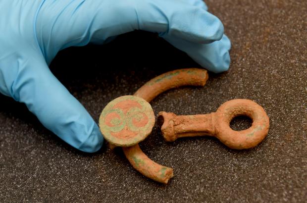 Milford Mercury: Placing the decorated bridle bit fragments. Picture: National Museum Wales