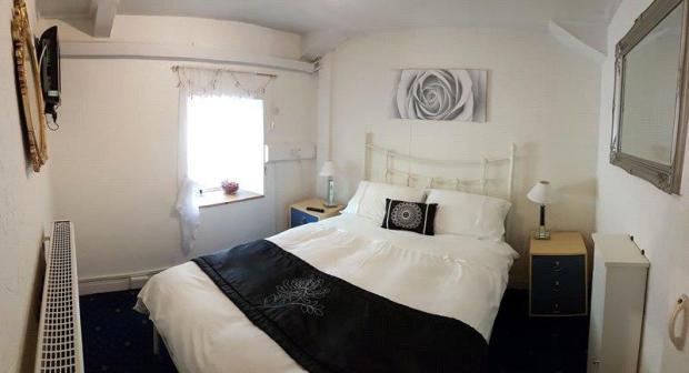 Milford Mercury: One of the bedrooms. Picture: Savills, Cardiff