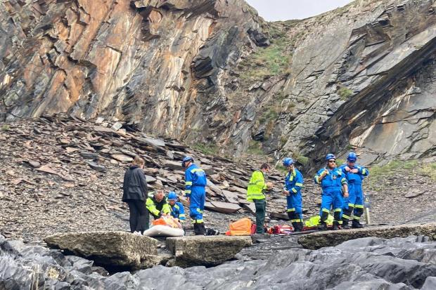 Fishguard Coastguards attends to Sam after he was pulled from the sea at the Blue Lagoon
Picture: HM Fishguard Coastguards
