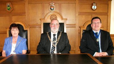 TOWN HALL LINE-UP: New mayor Cllr David Friend (centre) with his mayoress Wendy Friend (left) and new deputy mayor councillor Guy Woodham (right).