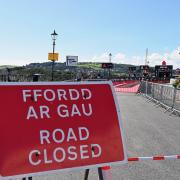 Tenby's Esplanade is being prepared for its transformation into the Ironman Wales finishing line.