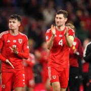 Wales' Ben Davies (right) and Neco Williams applaud the fans after the final whistle in the UEFA Euro 2024 Qualifying Group D match at the Cardiff City Stadium, Wales. Pic PA
